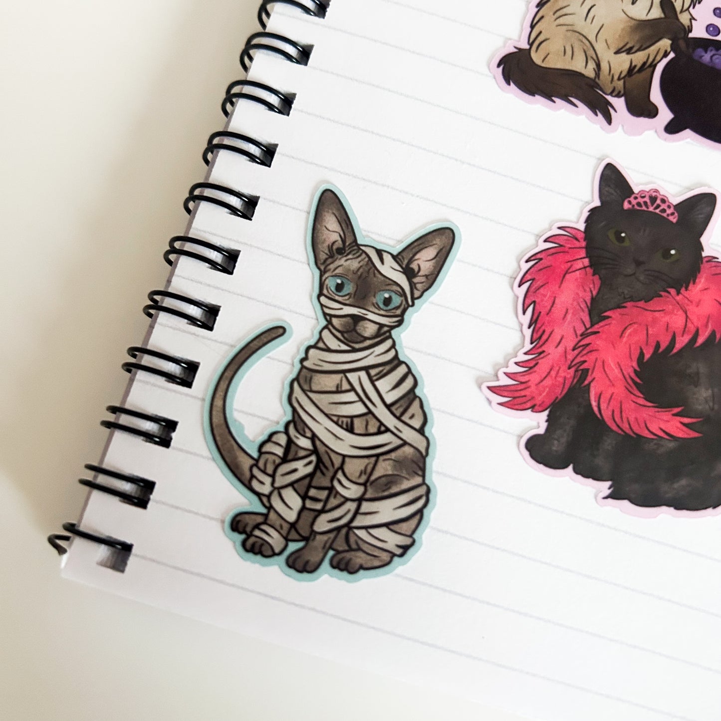 Grey Sphynx Cat Sticker in a mummy costume on paper
