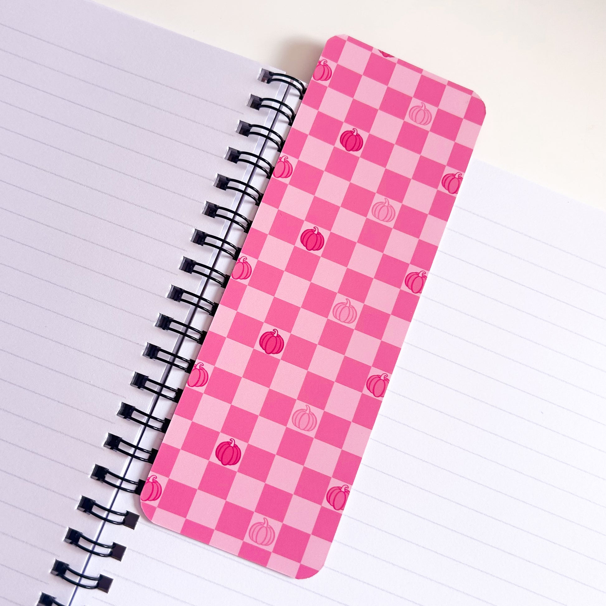 Pink Pumpkin Pattern Bookmark on top of lined book