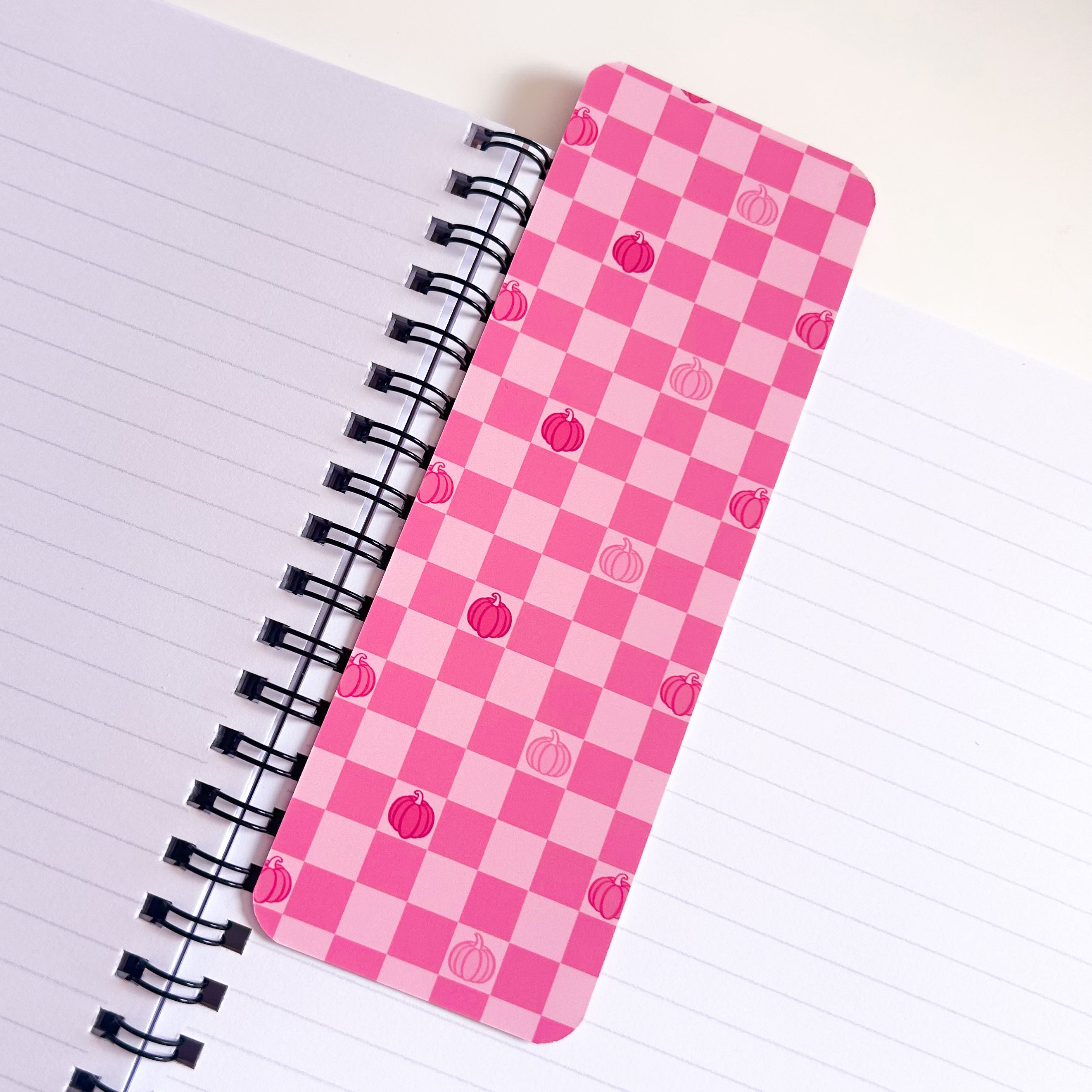 Pink Pumpkin Pattern Bookmark on top of lined book